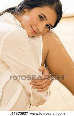 girl with arms around legs View Large Photo Image Stock Photo - girl with arms around legs. Fotosearch