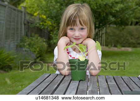 girl with plant View Large Photo Image Stock Photo - girl with plant. Fotosearch