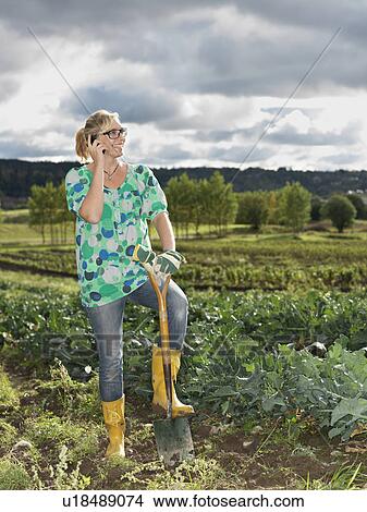 Picture - Girl with shovel. Fotosearch