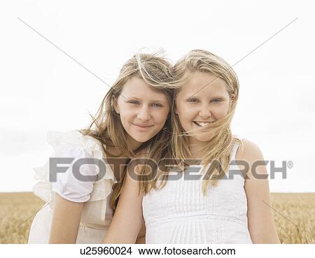 Picture - Girls in wheat field. Fotosearch