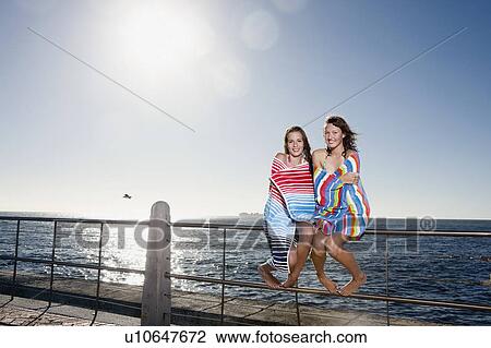 Girls wrapped in towels laughing View Large Photo Image Stock Image - Girls wrapped in towels laughing. Fotosearch