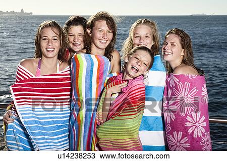 Girls wrapped in towels laughing View Large Photo Image Stock Image - Girls wrapped in towels laughing. Fotosearch