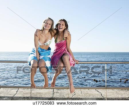 Girls wrapped in towels laughing. View Large Photo Image Stock Image - Girls wrapped in towels laughing.. Fotosearch