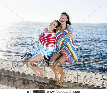 Girls wrapped in towels laughing View Large Photo Image Stock Photo - Girls wrapped in towels laughing. Fotosearch