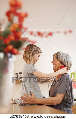 Stock Image - grandchild and grandma hugging. Fotosearch