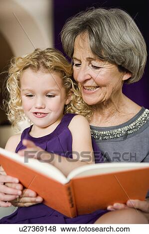 grandchild and grandma reading book View Large Photo Image Stock Photo - grandchild and grandma reading book. Fotosearch