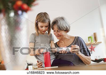 grandchild and grandma with candle View Large Photo Image Stock Image - grandchild and grandma with candle. Fotosearch