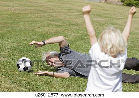 grandfather and child playing football View Large Photo Image Stock Photo - grandfather and child playing football. Fotosearch