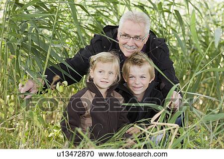 grandfather and grandchildren View Large Photo Image Stock Image - grandfather and grandchildren. Fotosearch