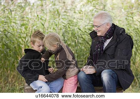 Stock Photo - grandfather and grandchildren. Fotosearch
