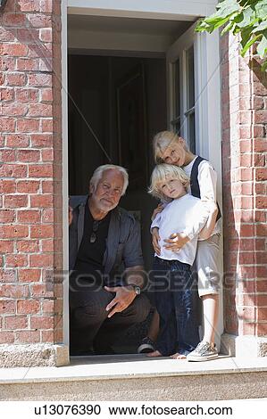 Stock Image - grandfather and grandchildren waiting. Fotosearch
