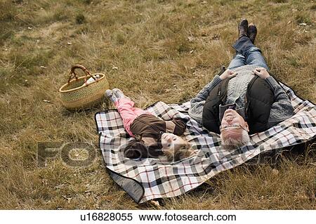 Stock Photography - grandfather and granddaughter at picnic. Fotosearch
