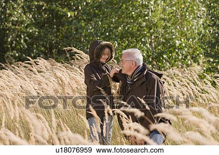 Stock Photo - grandfather and granddaughter. Fotosearch