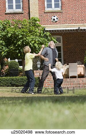 grandfather and kids with football View Large Photo Image Stock Photo - grandfather and kids with football. Fotosearch