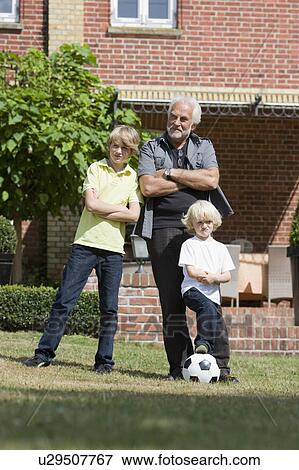 grandfather and kids with football View Large Photo Image Stock Photo - grandfather and kids with football. Fotosearch