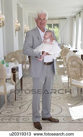 Grandfather holds granddaughter View Large Photo Image Stock Image - Grandfather holds granddaughter. Fotosearch