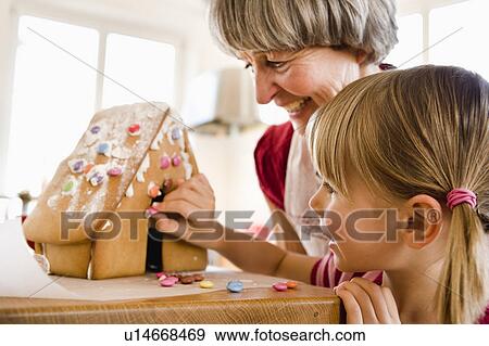 grandma and grandchild baking cake View Large Photo Image Stock Photo - grandma and grandchild baking cake. Fotosearch