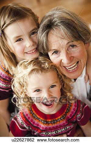 Stock Image - grandma and grandchildren hugging. Fotosearch