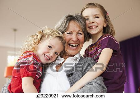Stock Image - grandma and grandchildren hugging. Fotosearch