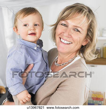 Stock Image - grandmother and baby boy. Fotosearch
