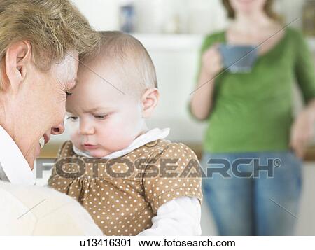 Stock Image - grandmother and baby. Fotosearch