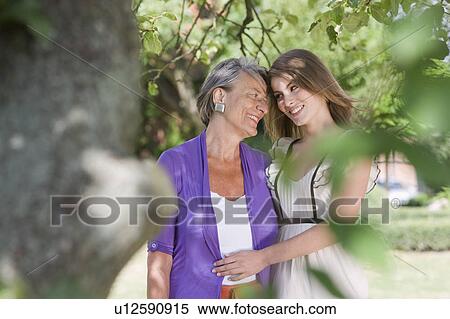 grandmother and granddaughter in garden View Large Photo Image Stock Photography - grandmother and granddaughter in garden. Fotosearch