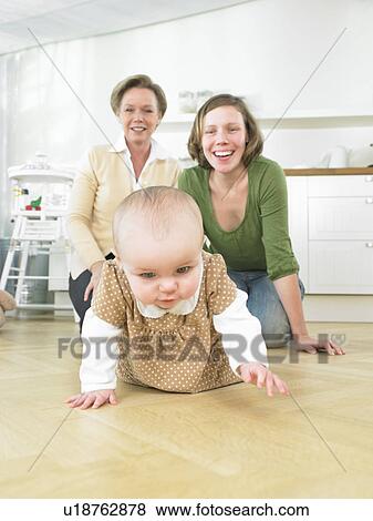 Stock Photo - Grandmother and mother with baby. Fotosearch