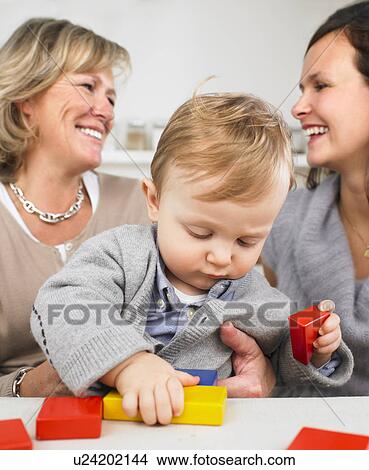 Picture - grandmother, mother and baby boy. Fotosearch
