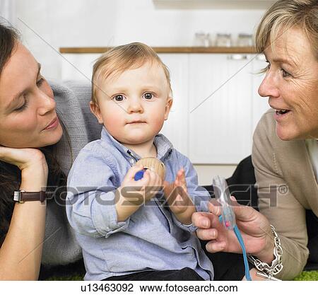 Stock Image - grandmother, mother and baby boy. Fotosearch