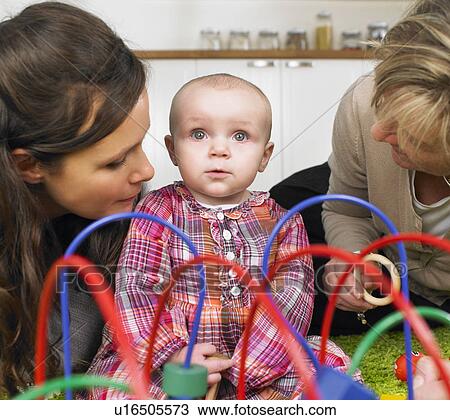 Stock Image - grandmother, mother and baby boy. Fotosearch