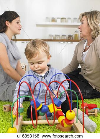 Stock Photo - grandmother, mother and baby boy. Fotosearch