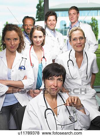Stock Photo - Group of doctors looking at camera. Fotosearch