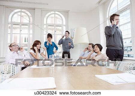 Group of people on mobile phones View Large Photo Image Picture - Group of people on mobile phones. Fotosearch