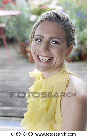 happy woman in garden View Large Photo Image Stock Image - happy woman in garden. Fotosearch