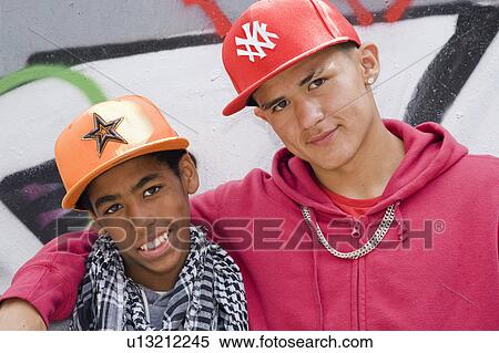 Hispanic and Black Teenagers smiling View Large Photo Image Stock Photography - Hispanic and Black Teenagers smiling. Fotosearch