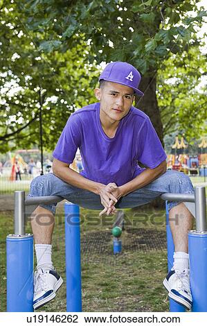 Hispanic Teenager in a park View Large Photo Image Stock Image - Hispanic Teenager in a park. Fotosearch