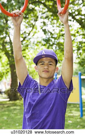 Hispanic Teenager in a park View Large Photo Image Stock Photo - Hispanic Teenager in a park. Fotosearch