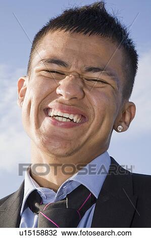 Stock Image - Hispanic Teenager in a suit. Fotosearch