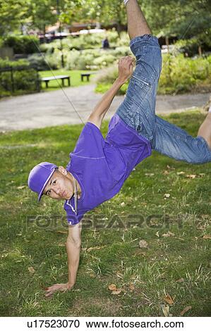 Hispanic Teenager street dancing in park View Large Photo Image Stock Image - Hispanic Teenager street dancing in park. Fotosearch