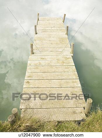 Stock Image - Jetty with cloud reflections. Fotosearch