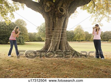 Picture - Kids with Tin Can Phones. Fotosearch