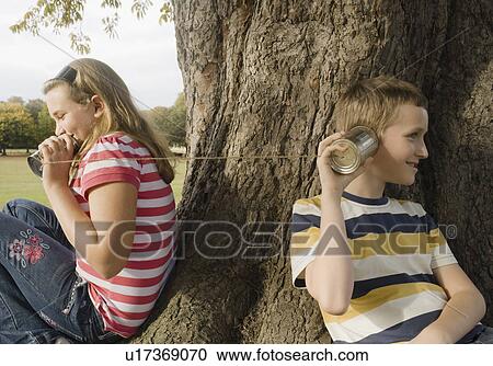 Stock Image - Kids with Tin Can Phones. Fotosearch