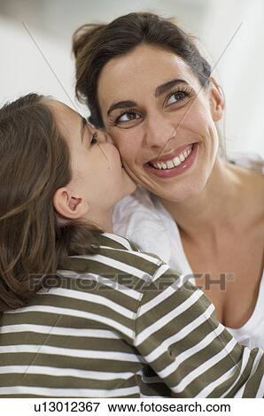 kisses of affection from a little girl View Large Photo Image Stock Photo - kisses of affection from a little girl. Fotosearch
