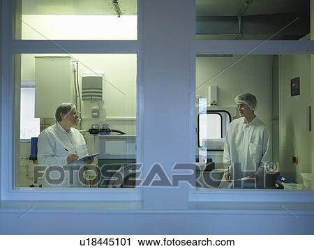 Stock Image - Laboratory Clean Room Technicians. Fotosearch