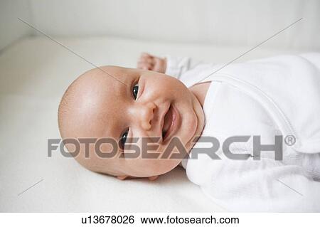 Stock Photograph - laughing baby. Fotosearch