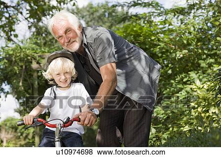 learning to ride a bicycle View Large Photo Image Stock Photo - learning to ride a bicycle. Fotosearch