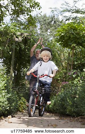 learning to ride a bicycle View Large Photo Image Stock Photography - learning to ride a bicycle. Fotosearch