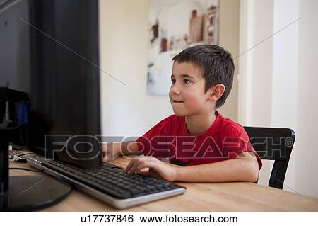 little boy at the computer View Large Photo Image Stock Photograph - little boy at the computer. Fotosearch