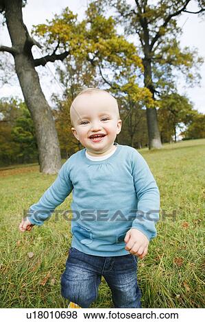 Stock Photo - little child in park. Fotosearch