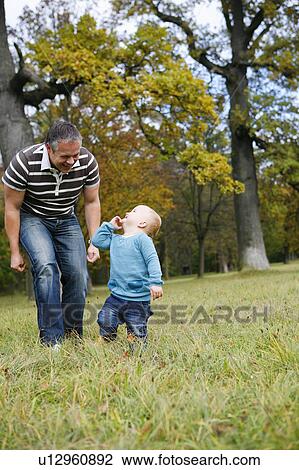 little child in park with father View Large Photo Image Stock Image - little child in park with father. Fotosearch